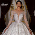 Vestido de Noiva Princesa com Brilho, Renda e Mangas Compridas
